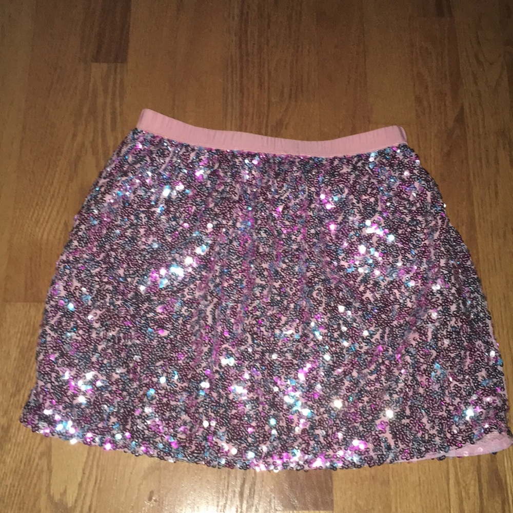 Skirt with blue, pink, and purple sparkles.